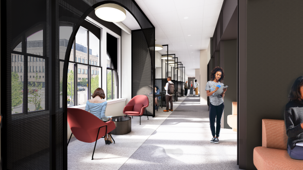 people working near a window in office space